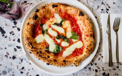 Neapolitan pizza is a classic Italian pizza style key elements of Neapolitan pizza is its preparation in a wood-burning oven