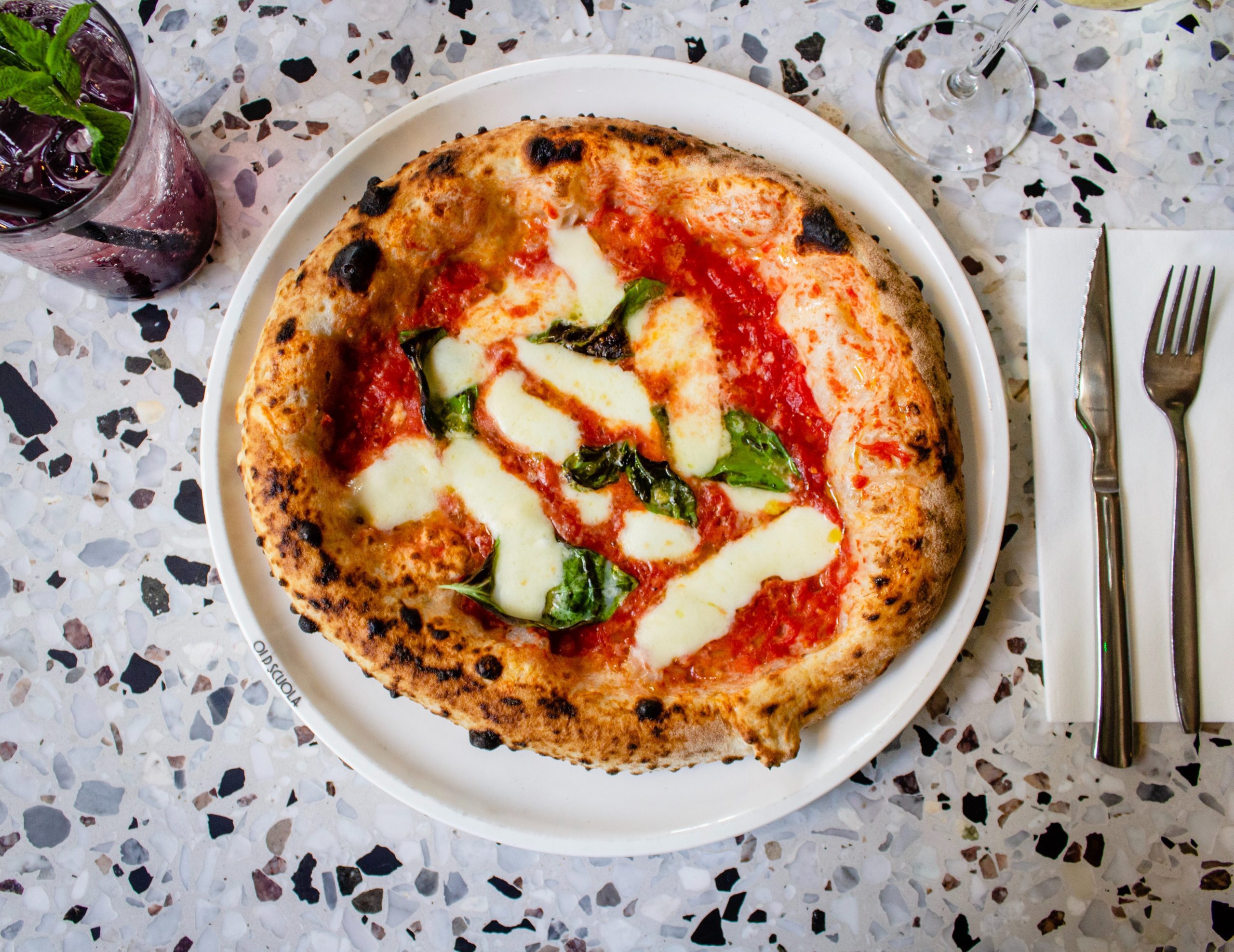 Neapolitan pizza is a classic Italian pizza style key elements of Neapolitan pizza is its preparation in a wood-burning oven