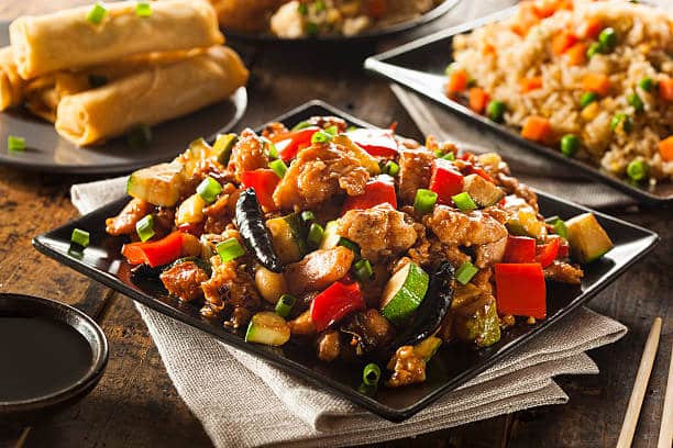 Kung Pao Chicken is a Sichuan dish made with diced chicken peanuts vegetables and chili peppers