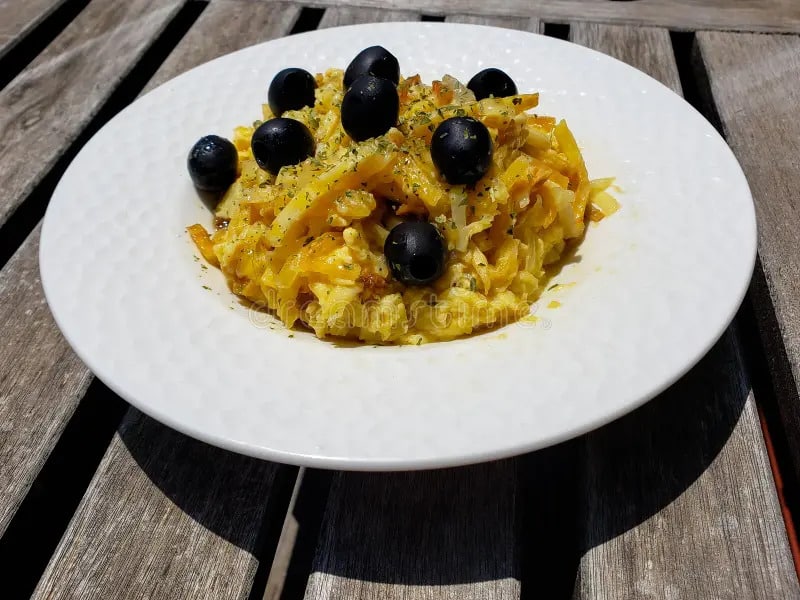 Bacalhau à Brás is a traditional Portuguese dish made with salted cod (bacalhau), thinly chopped (matchstick-sized) fried potatoes, scrambled