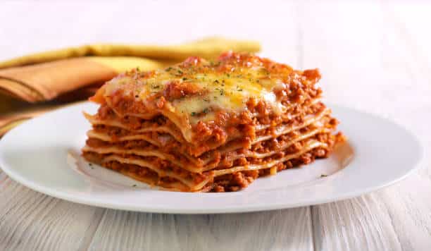 Imagine a dish that's as comforting as a warm hug where layers of pasta rich sauce and creamy cheese