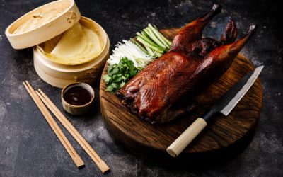 Peking duck is a famous Chinese dish known for its crispy skin and tender meat. Roast a whole duck until the skin turns golden and crispy